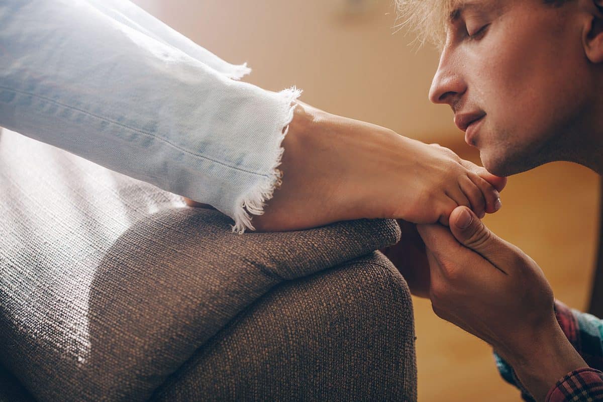 Man loving a woman's foot