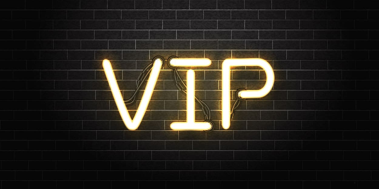 VIP in neon on a brick wall